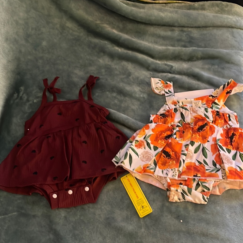 Brand new baby girl cute dresses with snap able bottom attached.